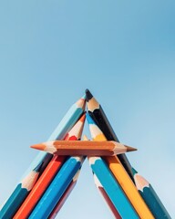 Poster - Creating a vibrant triangle with colorful pencils abstract minimalist art arrangement studio photography clean environment aesthetic concept