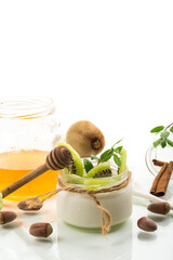 Canvas Print - Homemade yogurt in a glass jar with honey, kiwi, nuts.