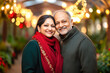 © PRASANNAPIX - happy indian couple holding gift box on Christmas festival