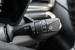 © gracethang - Close-up view of the car headlight switch controls.