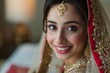 © AJay - Portrait of a smiling young woman wearing traditional Indian bridal costumes and jewellery