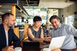 © Marko Geber - Business meeting at cafe with diverse team