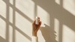 © นัสรีน ถนอมวงศ์ - Hand holding skincare product natural light minimalist aesthetic indoor setting close-up view self-care concept