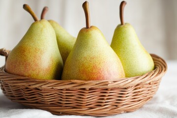 Wall Mural - Four pears arranged in a basket on a table, perfect for still life photography or fruit display