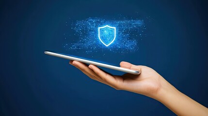 Poster - Digital Security Concept: A Hand Holding a Tablet with a Shield Icon Representing Cyber Protection and Online Safety in a Modern Tech Environment