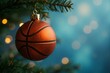 © Ciro - A christmas ornament in the shape of a basketball ball hanging from a tree with a out of focus blue background