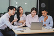 © ARMMY PICCA - Entrepreneurs and business people conference in modern meeting room, happy multiracial coworkers have fun cooperating working together at office meeting, asian teamwork concept
