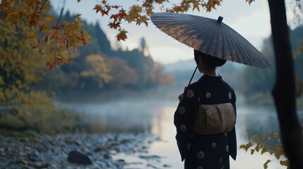 Wall Mural - 静かな川沿いで傘を差す日本人女性の穏やかな秋の風景