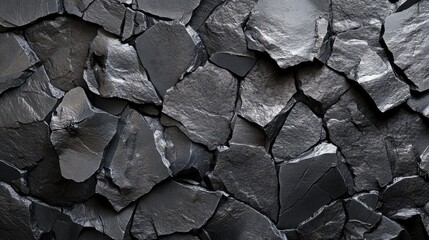 Poster - A textured surface of dark, rough slate stones stacked together, creating an abstract and natural aesthetic.