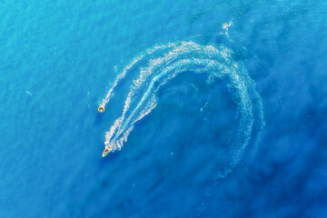 Wall Mural - aerial view on fast boat on blue sea at sunny day. vacation and leisure. seascape from the drone. se