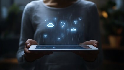 Fototapete - A person holds a tablet displaying floating icons representing data and connectivity.