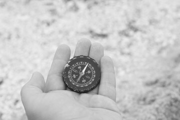 Wall Mural - round compass in hand on abstract background