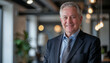 © Rgfx - Happy mid aged older business man executive standing in office. Smiling 50 year old mature confident professional manager, confident businessman investor looking at camera,