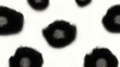© Olga - A grayscale picture featuring an array of black dots on a black background with a centralized group of dots surrounded by other dots