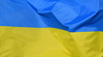 Wall Mural - Close-up of the national flag of Ukraine, fluttering in the wind with folds, wave pattern