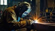 © azi - Welder in action, sparks flying during metal fabrication.