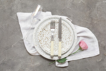 Wall Mural - Stylish table setting with flower  on grey grunge background