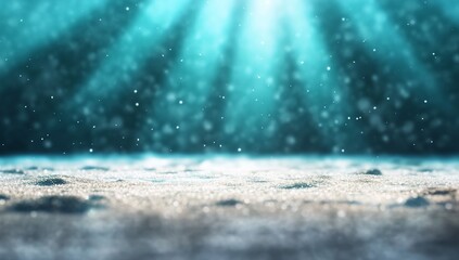 Underwater scene with soft light rays illuminating sandy ocean floor.