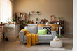 © Pixel-Shot - Cozy sofa with pillows and plaid in interior of kitchen