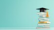 © MAY - A stack of books with a graduation cap resting on top, symbolizing the culmination of years of hard work and dedication to education.