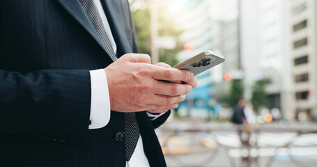Aufkleber - Phone, hands and businessman in city with typing for email, communication or networking online in morning. Technology, cellphone and closeup of Japanese male lawyer with contact in urban town.