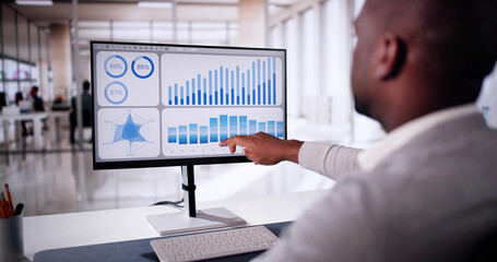 Poster - African American Man Analyzing Financial Data On Computer Screen