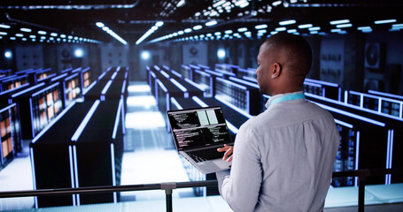 Wall Mural - Happy Engineer In Data Center Server Room Configuring AI