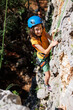 © zhukovvvlad - rock climber boy. a boy in a helmet climbs a rock. a child is rock climbing at a summer camp. rock climbing..