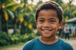© ThomasLENNE - Close portrait of a smiling Micronesian male kid looking at the camera, Micronesian outdoors blurred background