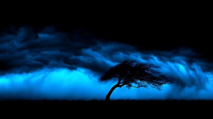 Wall Mural - Dramatic Stormy Sky with Blue and Black Clouds Behind a Solitary Tree on a Dark Landscape
