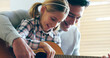 © peopleimages.com - Guitar, learning and child with dad, lesson and family in home with music, development and creativity. Living room, musician and knowledge with love, support and bonding together on sofa with play