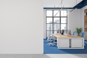 Wall Mural - Empty white wall mockup next to modern office workspace with computers and large windows. 3D Rendering