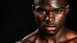 © Giovanni - Intense portrait of a determined male MMA fighter with a glistening physique, set against a striking black background, showcasing strength and focus.
