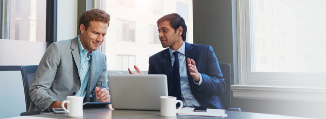 Wall Mural - Men, laptop and office for investment report, finance and online for budget proposal or profit ideas. Employees, communication and brainstorming in meeting, growth opportunity and collaboration