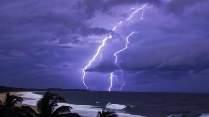 Aufkleber - A coastal scene unfolds as lightning illuminates the dark sky above the ocean at night. The beach is visible in the foreground, enhancing the stormy atmosphere.