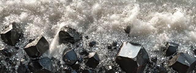 Poster - A close-up view of dark rocks by a turbulent sea, capturing the interplay of water and stone.