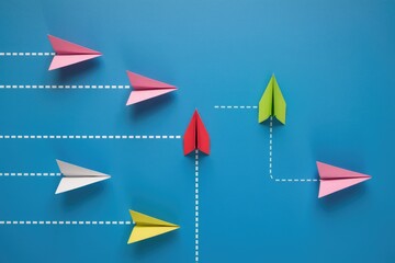 Aufkleber - Paper airplanes flying in different directions on a blue background.