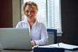 © ReeseFullyOwned/peopleimages.com - Business, female financial advisor and laptop at desk to review clients savings budget, reading profit data and revenue. Employee, woman or happy in office for asset management or retirement planning