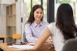 © David - Financial Business two women analyze the graph of the company's performance to create profits and growth, Market research reports and income statistics, Financial and Accounting concept.