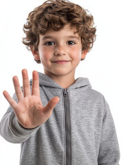 Happy boy making halt hand gesture representing stop or no access, isolated on white background, upper body fully visible, half body shot, centered, joyful expression