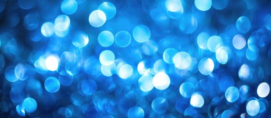 Poster - Abstract blue bokeh lights in a blurred background perfect for design projects and creative applications