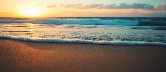 Poster - Scenic ocean shoreline with gentle waves and golden sand at sunset creating a tranquil and serene coastal landscape