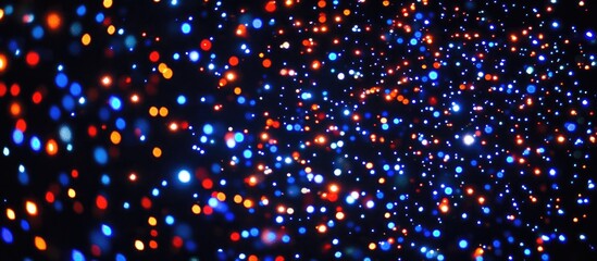 Poster - Abstract vibrant starry night LED lights in a blurred out of focus effect against a deep black background creating a dreamy atmosphere