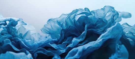 Poster - Abstract blue fabric waves creating a sense of fluidity and depth in a serene atmosphere suitable for backgrounds or artistic projects