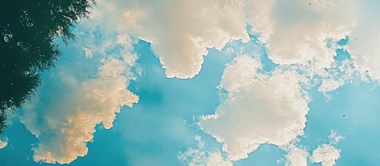 Poster - Sky and clouds beautifully reflected in calm water creating a serene nature landscape portrait