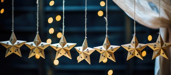 Aufkleber - Holiday decorations featuring wooden star garlands adorned with soft glowing lights for a festive atmosphere during New Year celebrations.