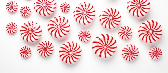 Poster - Candy cane pattern design on white background showcasing peppermint candies in various sizes for festive and seasonal themes