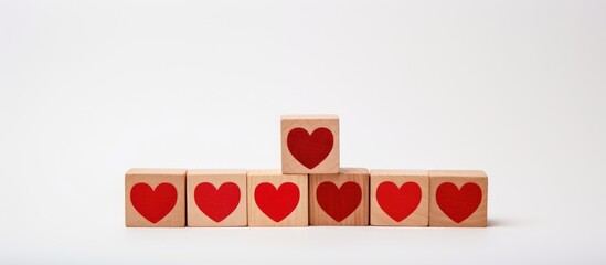 Poster - Red Heart and LOVE YOU text displayed with wooden blocks on a clean white background for romantic and heartfelt concepts