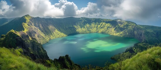 Poster - Mountain landscape with vibrant green hills and a crystal blue lake under dramatic skies in the foreground showcasing natural beauty.