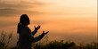 © doidam10 - Christian woman raised her hand in worship and prayer to God, seeking peace through Jesus Christ during a serene sunrise morning. worship, christian, jesus christ, hand, god, peace, pray, sunrise.